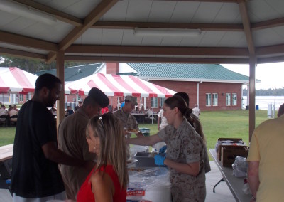 people serving food for fish fry