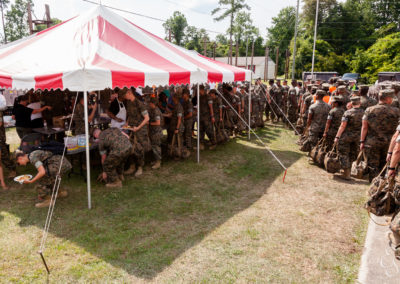 Marines in line for food under tent