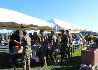 marines getting food at fish fry in line